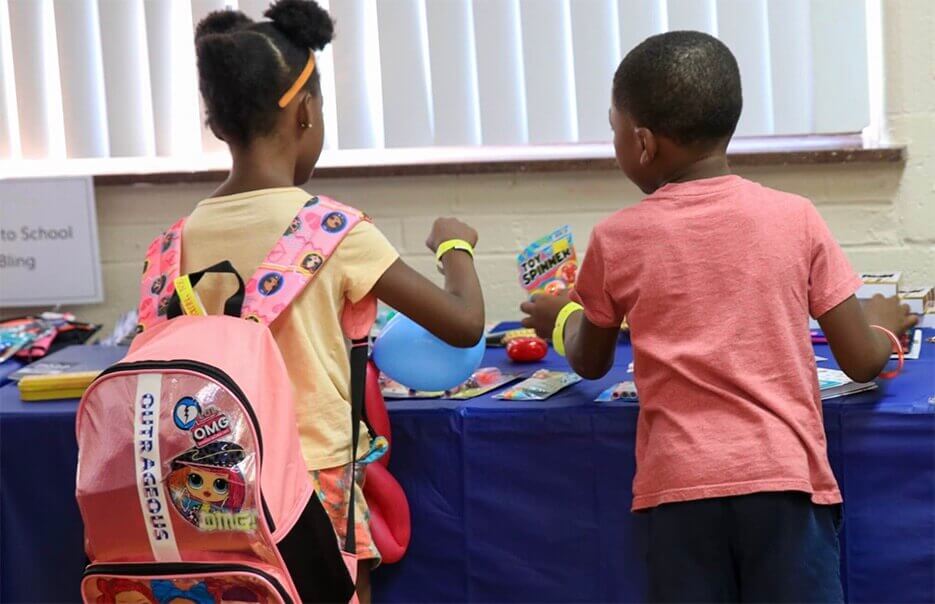 Children with Backpacks at The City Mission